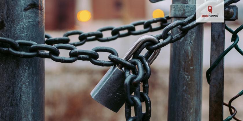 A padlock holding some chains together