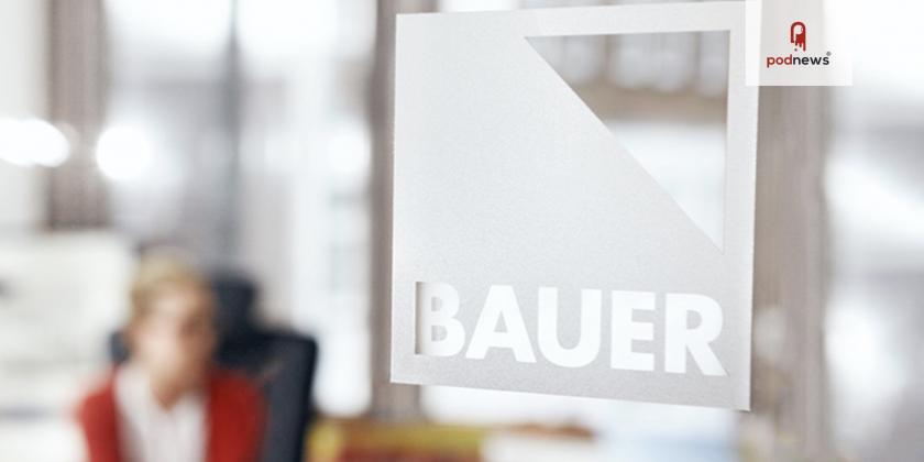 A Bauer logo on a glass window