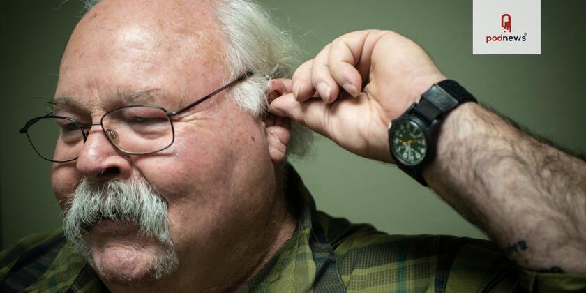 A man holding his ear