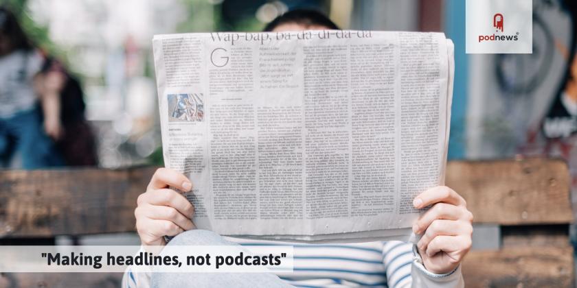 A man reading a headline in a newspaper