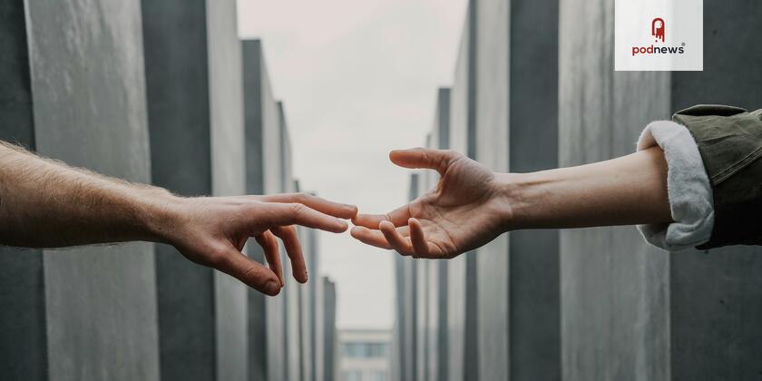 Two hands reaching for each other