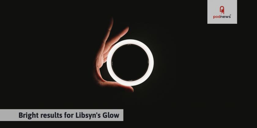 A glowing speaker in someone's hand