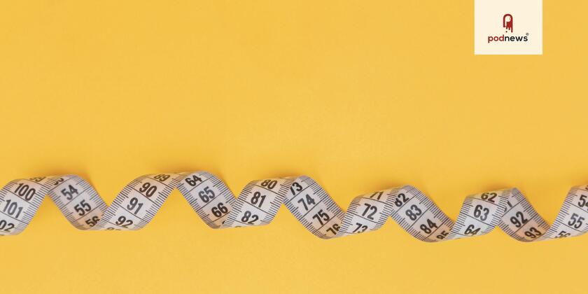 A measuring tape on a bright yellow background