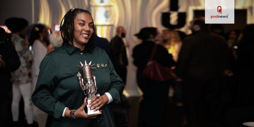 A winner holding an award