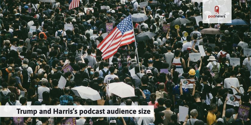 A crowd, with one waving a US flag