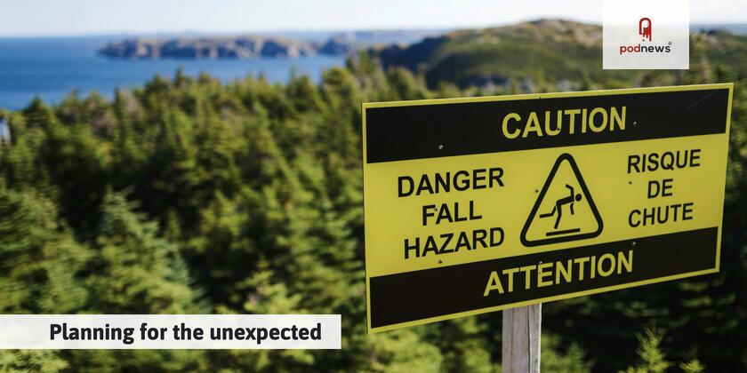 A sign warning about slippery paths in the woods