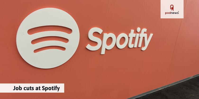 A Spotify logo on a wall