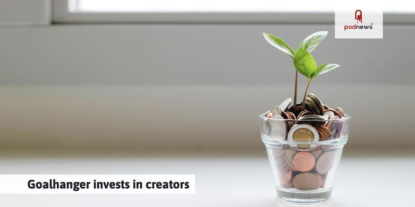 A cup of money with a plant growing out of it