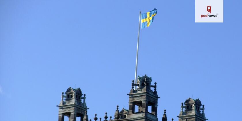 A Swedish flag flying over a building in Stockholm