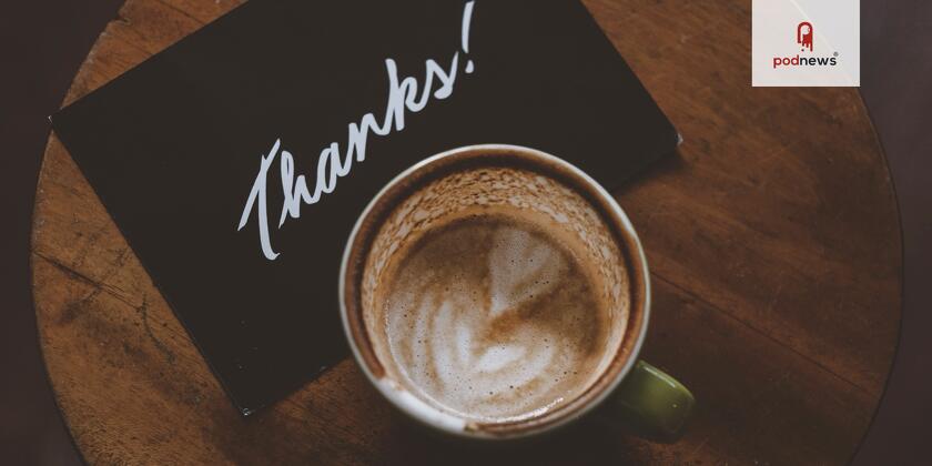A cup of coffee and a sign saying Thanks!