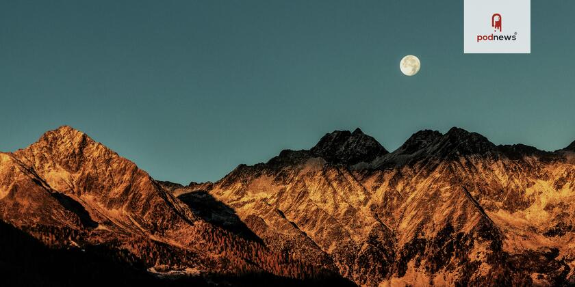 The Moon, over some mountains