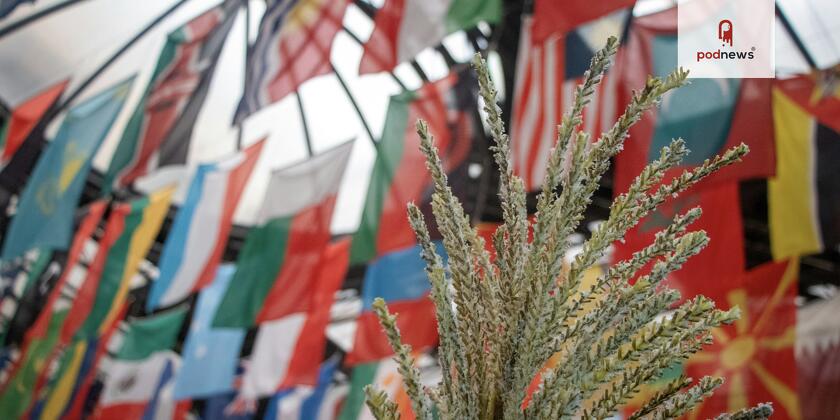 Grain displayed under national flags at the UN FAO Headquarters in Rome.