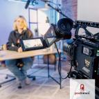 A camera pointing to a presenter