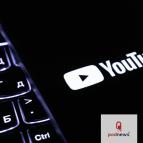 A YouTube logo, over a keyboard