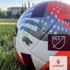 A Major League Soccer ball in a park