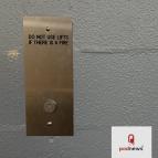 A down button on a lift in a hotel in Darwin NT, Australia