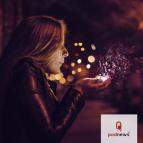 A woman blows some magic dust out of her hand